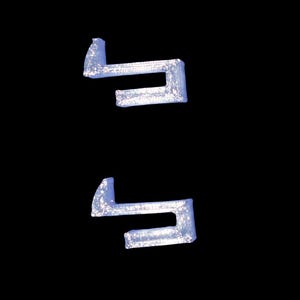 May include: Two light blue, stylized letterforms against a black background. The shapes have a textured, glittery appearance, with a slight 3D effect. The design is simple and modern.