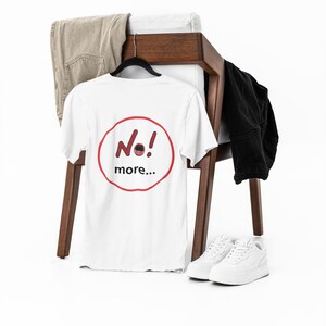 NO! MORE... is a wearable protest against escalation, conflict, noise and power without reflection.

This unisex graphic t-shirt combines raw hand-drawn typography with a human scream hidden inside the message — turning a simple phrase into a visual reaction.
