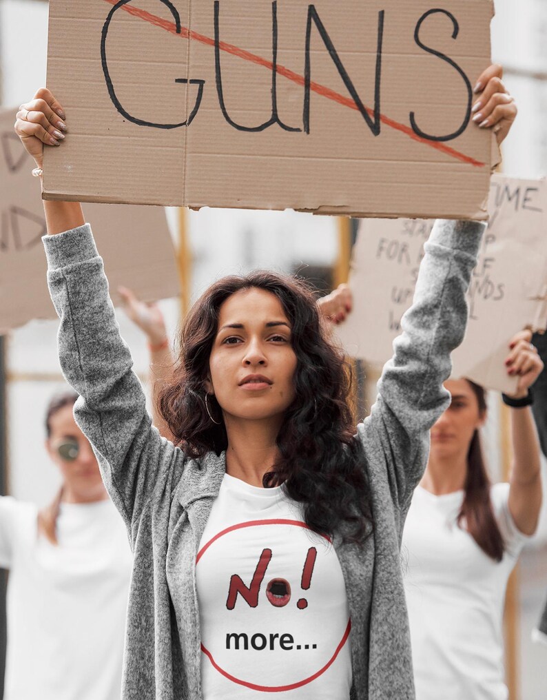 NO! MORE... is a wearable protest against escalation, conflict, noise and power without reflection.

This unisex graphic t-shirt combines raw hand-drawn typography with a human scream hidden inside the message — turning a simple phrase into a visual reaction.