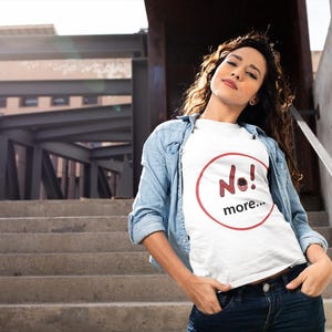 NO! MORE... is a wearable protest against escalation, conflict, noise and power without reflection.

This unisex graphic t-shirt combines raw hand-drawn typography with a human scream hidden inside the message — turning a simple phrase into a visual reaction.