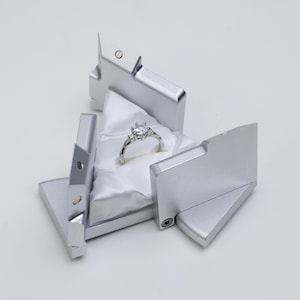 Argento - Scatola con anello di energia cinetica con collegamento meccanico creativo, regalo di proposta romantica, regali e giocattoli scientifici