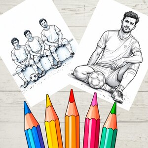 May include: Two black and white soccer-themed coloring pages featuring illustrations of soccer players and soccer balls. Five colored pencils in blue, yellow, orange, pink, and green are in the foreground.