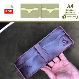 May include: Open, dark brown leather wallet with red stitching. The wallet has multiple card slots and a bill compartment. The text "E.TORO" is visible on the wallet. The image also includes a PDF icon and the text "A4 Digital pattern Download".