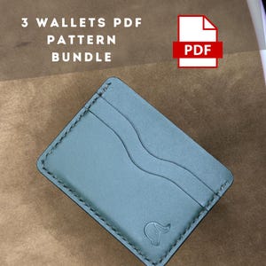 May include: A teal leather wallet with a stitched edge and a small logo on the bottom. The wallet has three card slots and a money pocket. The image is accompanied by the text "3 WALLETS PDF PATTERN BUNDLE" and a PDF icon.