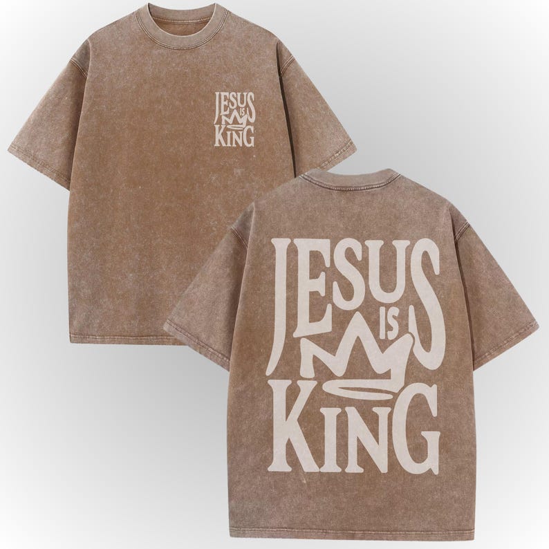 A beige t-shirt with the text "JESUS IS KING" printed on the back.