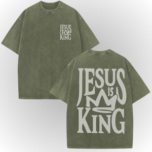 A green t-shirt with white text on the back.