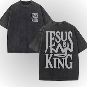 A black t-shirt with white text on the back, which says "JESUS IS KING".