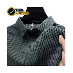 May include: Dark gray collared shirt with a textured weave pattern. The shirt has black buttons and a classic collar. The image includes a gold badge that says "100% AUTHENTIC".