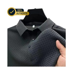May include: A dark gray collared shirt with a textured weave pattern. The shirt has a button-down front and is displayed on a black hanger. The text "100% AUTHENTIC" is in a gold circle.