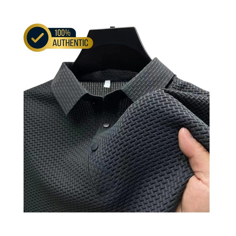 May include: A dark gray collared shirt with a textured weave pattern. The shirt has a button-down front and is displayed on a black hanger. The text "100% AUTHENTIC" is in a gold circle.