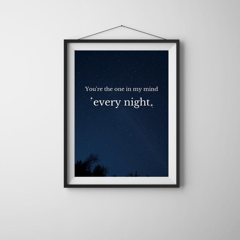 May include: A black framed print with a dark blue night sky background and white stars. The print features the text "You're the one in my mind every night."