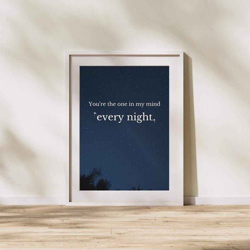 May include: A white framed print with a dark blue background and white stars. The text on the print reads "You're the one in my mind *every night."