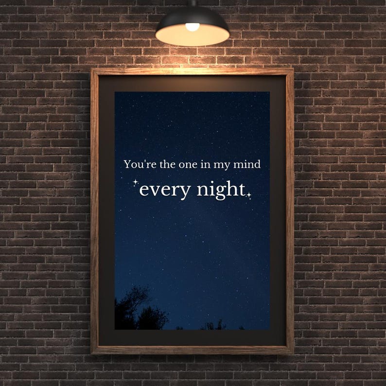 May include: A framed print with a dark blue starry night sky background. The text "You're the one in my mind every night." is printed in white on the print.