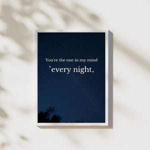 May include: A white framed print with a dark blue night sky background filled with stars. The text on the print reads "You're the one in my mind *every night.*"