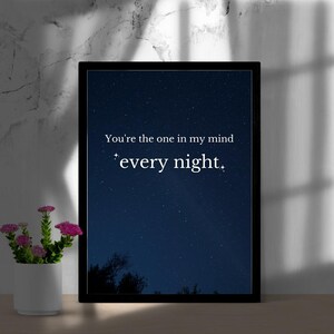 May include: A black framed print with a dark blue starry night sky background. The text "You're the one in my mind *every night*" is printed in white on the print.