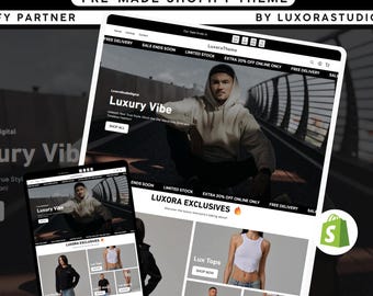 May include: A digital mockup showcasing a clothing Shopify theme. The theme is displayed on a laptop and a phone, featuring a modern design with images of apparel. Text includes "Luxury Vibe" and "Shop All."