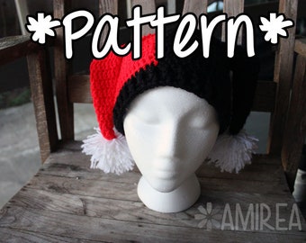 May include: A red and black crocheted hat with white pom-poms. The hat is shaped like a jester's cap and has a *Pattern* written above it.