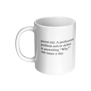 May include: White ceramic mug with a black text definition of "parent" as a professional problem solver skilled in answering "Why?" 500 times a day. The mug has a curved handle.
