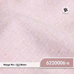 May include: Close-up of a light pink fabric with a textured, repeating square pattern. The fabric is slightly folded, showing depth and dimension. The image includes the text "6220006-x".