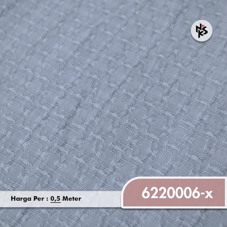 May include: Light blue fabric with a textured, woven pattern. The fabric has a subtle, repeating design. The image includes the product code "6220006-x".