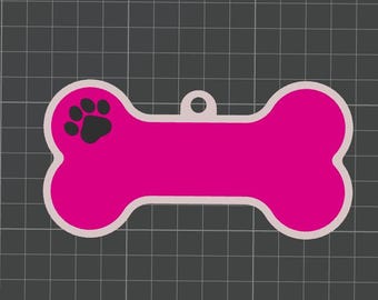 May include: A bright pink dog bone-shaped tag with a black paw print on the left side. The tag has a white border and a hole for attaching to a collar. The background is a dark gray grid.
