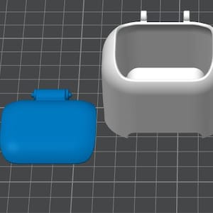 May include: A 3D-rendered image of two plastic components. One is a blue, rectangular piece with a small handle. The other is a white, open-topped container with a rounded shape and two small protrusions at the top. The background is a gray grid.