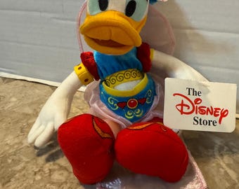 Puffs Delilah Daisy Duck con etiquetas, Disney Store de Londres, raros