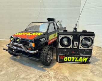 Vintage 1992 Tyco Outlaw RC Truck UNTESTED Repair Parts Back To The Future BTTF. Sold as is no returns no exchanges.