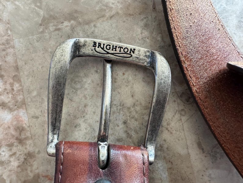 May include: A set of three ceramic vases in varying heights and shapes. The vases are glazed in a matte white finish, offering a minimalist aesthetic. The tallest vase measures approximately 10 inches in height.