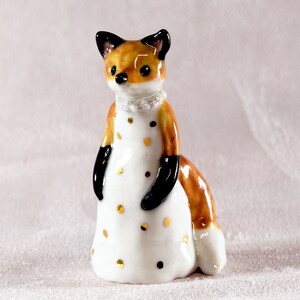 Little red fox figurine wearing a white dress with gold spots ceramic figurine sculpture ooak fox totem image 1