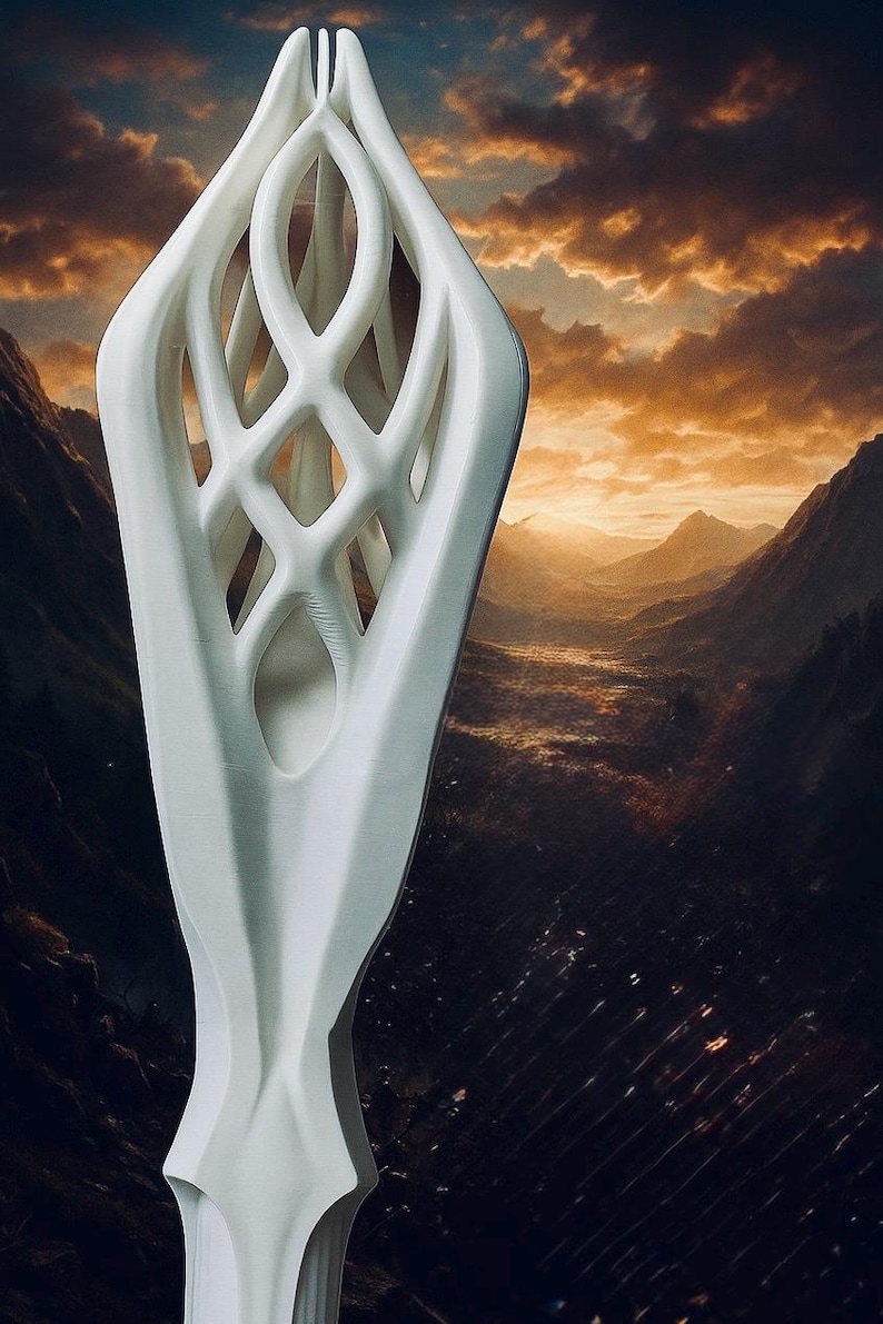 May include: A tall, white, abstract sculpture with a lattice-like design. The sculpture has a smooth, curved exterior and a complex, open interior. The background features a dramatic landscape with mountains and a sunset.