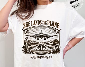 She Lands the Plane Shirt, Women Pilot Graphic Tee, Female Aviator Confidence Shirt, Aviation Gift for Her