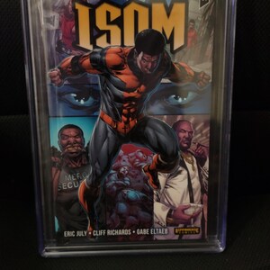 May include: A graded comic book with a 9.8 rating. The cover features a superhero in a red, blue, and black costume. The title of the comic is "ISOM #1" and the publisher is "Rippaverse Comics".