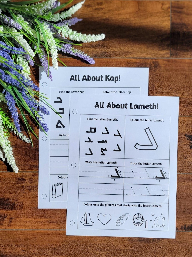 May include: Two white worksheets with the titles "All About Kap!" and "All About Lameth!" are displayed on a wooden surface. The worksheets feature exercises to find, color, write, and trace letters, along with related illustrations.