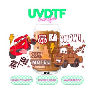 May include: A glass can-shaped cup filled with a brown liquid, featuring a UVDTF transfer design with a red race car, a brown tow truck, a Route 66 sign, a Cozy Cone Motel sign, checkered flags, and the text KA-CHOW. Includes labels: READY TO APPLY, DOUBLE SIDED, WATERPROOF.
