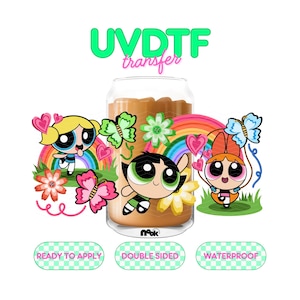May include: A clear glass with a brown liquid inside, featuring a colorful design of Powerpuff Girls characters, butterflies, flowers, and rainbows. The text "UVDTF transfer" is at the top, with the words "Ready to Apply", "Double Sided", and "Waterproof" at the bottom.