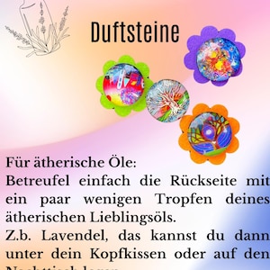 May include: Four colorful round felt coasters with a glass insert. The coasters are decorated with different designs. The text "Duftsteine" is at the top of the image. The text below the coasters reads "For essential oils: Simply drizzle the back with a few drops of your favorite essential oil. For example, lavender, you can then place it under your pillow or on your nightstand."