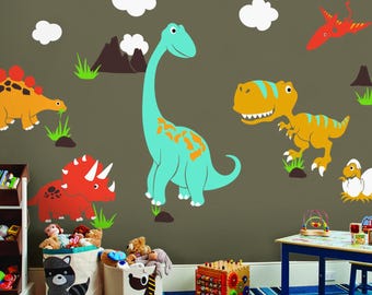 May include: A child's room decorated with colorful dinosaur wall decals. The scene includes a large teal Brontosaurus, a yellow T-Rex, and other dinosaur figures, along with clouds and mountains. The room also features toy storage bins and a blue striped rug.