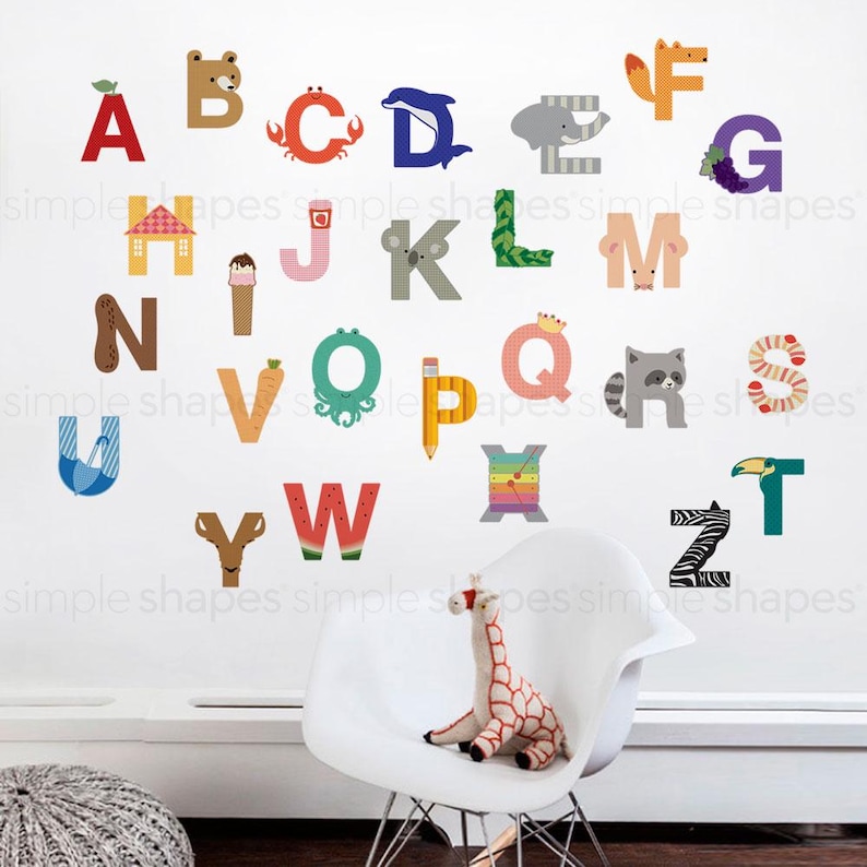 May include: Colorful alphabet wall decals featuring letters A through Z, each designed with a unique animal or object illustration. The letters are in various colors and styles, perfect for a child's room or educational space.