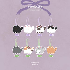 May include: A collection of eight acrylic cellphone charms featuring cartoon cat designs, each representing a different MBTI personality type. The charms are in various colors, including black, white, brown, and gray, with a purple ribbon at the top. Text on the image reads "MBTI CATS".