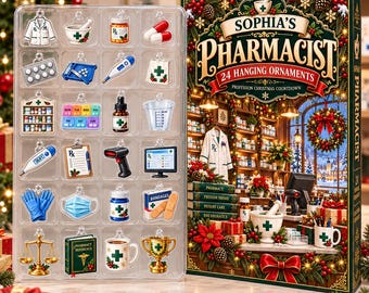 May include: A set of 24 pharmacist-themed hanging ornaments in a clear plastic tray next to a box labelled Sophia's Pharmacist 24 Hanging Ornaments. The ornaments include medical items like a lab coat, pills, thermometer, mask, and scale.