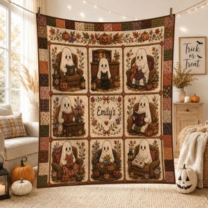 May include: A rectangular quilt featuring a grid of nine panels with illustrations of white ghosts in cozy settings, surrounded by autumn-themed floral borders and pumpkins. The center panel displays the text Emily's surrounded by a floral wreath.