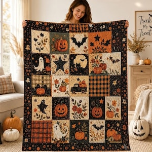 May include: A rectangular patchwork quilt featuring a Halloween theme with various squares displaying pumpkins, ghosts, black cats, bats, stars, floral patterns, and a truck. The color palette includes black, orange, cream, and brown tones.