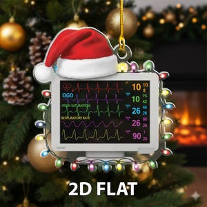 May include: A Christmas ornament shaped like a medical monitor, topped with a Santa hat. The monitor displays vital signs and is framed by colorful lights. The text "2D FLAT" is at the bottom.