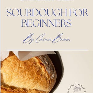 May include: A book titled "Sourdough for Beginners" by China Bronn, with a close-up image of a sourdough loaf of bread. The book cover is beige with blue text. The book is for learning the basics of sourdough bread baking.