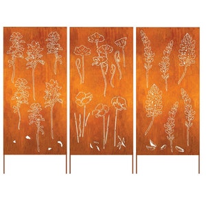 May include: Three rust-colored metal panels with white floral designs. Each panel has a different design of flowers and is mounted on a metal stand.
