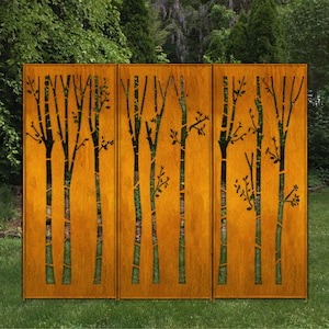 May include: A three-panel outdoor screen with a rust-colored finish. The screen features a cut-out design of stylized trees with black branches and green accents, set against a natural backdrop of greenery.
