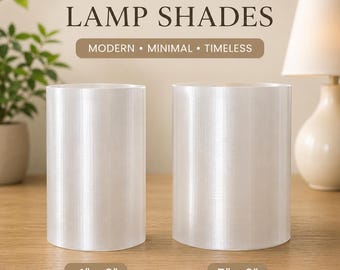 May include: Two cylindrical translucent lamp shades with a subtle vertical texture. The left shade is labelled 4 inches by 6 inches, and the right shade is labelled 5 inches by 6 inches. The text reads TRANSLUCENT LAMP SHADES MODERN MINIMAL TIMELESS.