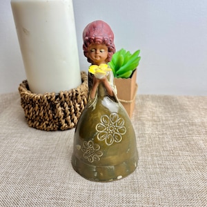 Vintage Ceramic Bell – Hand-Painted 70&#39;s floral dress Girl  holding yellow Flower – Collectible Bell Figurine