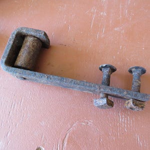 Rusty Heavy Metal Piece of Hardware with Nuts Bolts and Rusted Metal Roller, About 6&quot;